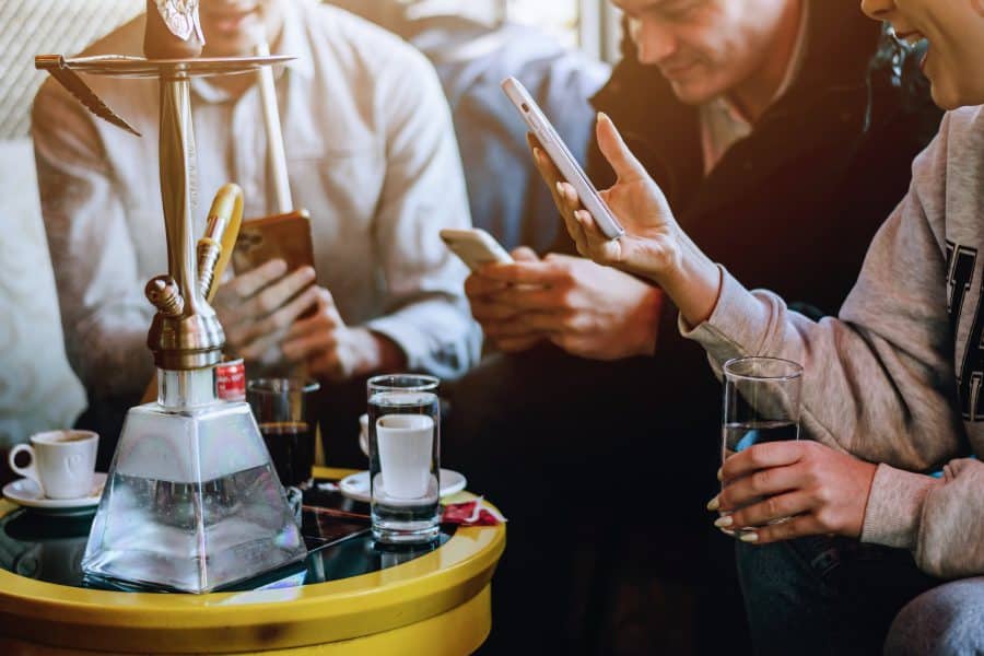 Group of people smoking shisha